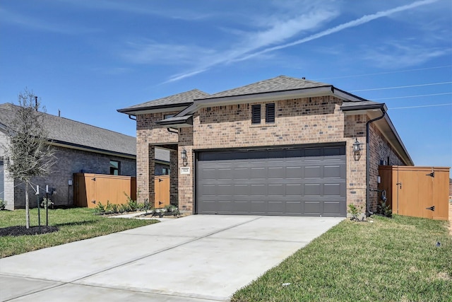 5028 Marcasca Dr, Katy, TX 77493 - prairie-style home with a garage, fence, a front lawn, brick siding, and concrete driveway