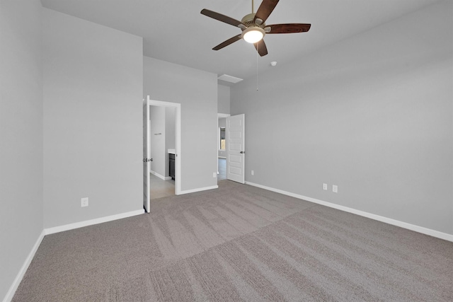 5028 Marcasca Dr, Katy, TX 77493 - unfurnished bedroom with baseboards, a ceiling fan, carpet, and a towering ceiling