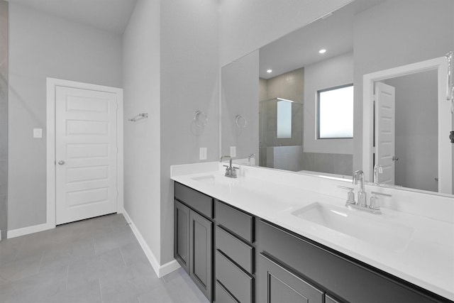 5028 Marcasca Dr, Katy, TX 77493 - bathroom featuring a stall shower, a sink, and baseboards