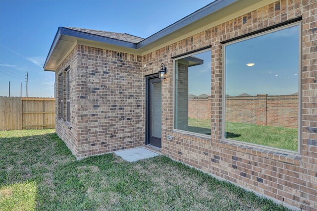 5028 Marcasca Dr, Katy, TX 77493 - entrance to property with a yard, fence, and brick siding