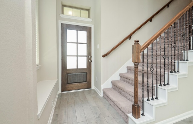 5203 Prairie Terrace Ln, Fulshear, TX 77441 - entrance foyer with baseboards, stairway, and wood finished floors