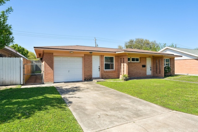 view of front of property featuring concrete driveway, fence, an attached garage, a front lawn, and brick siding