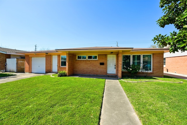 single story home featuring fence, an attached garage, concrete driveway, a front yard, and brick siding