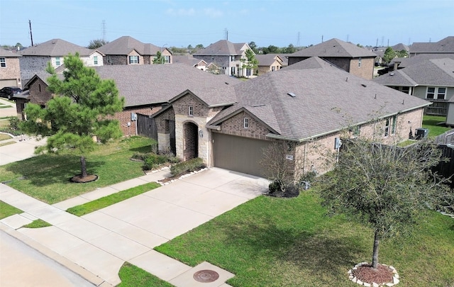 1807 Iris Knoll Ln, Pearland, TX 77089 - french country inspired facade featuring a residential view, roof with shingles, driveway, a front yard, and a garage