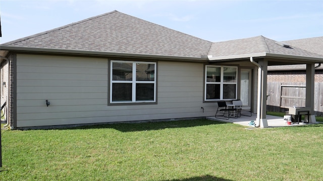 1807 Iris Knoll Ln, Pearland, TX 77089 - rear view of house featuring a patio area, fence, a lawn, and roof with shingles