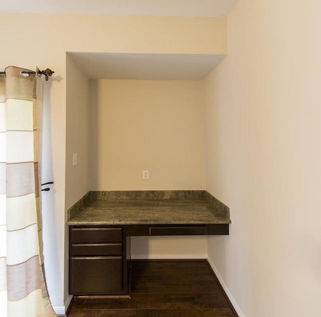 737 Davis Rd, League City, TX 77573 - interior space with baseboards, built in study area, and dark wood finished floors