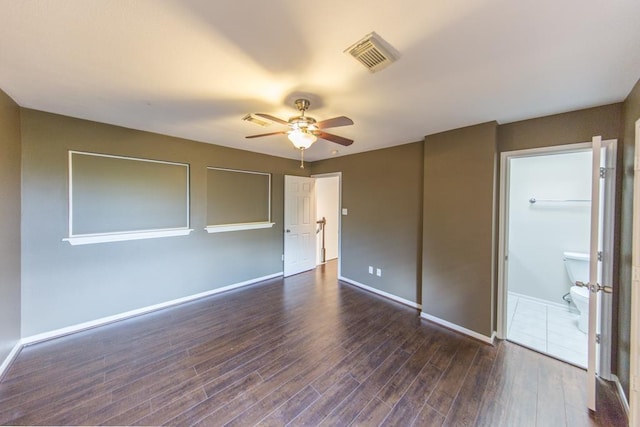 737 Davis Rd, League City, TX 77573 - unfurnished bedroom with dark wood-style flooring, visible vents, baseboards, and ceiling fan