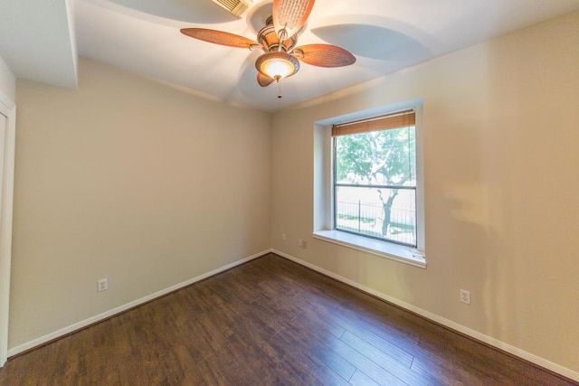 737 Davis Rd, League City, TX 77573 - unfurnished room featuring dark wood-style flooring, ceiling fan, and baseboards
