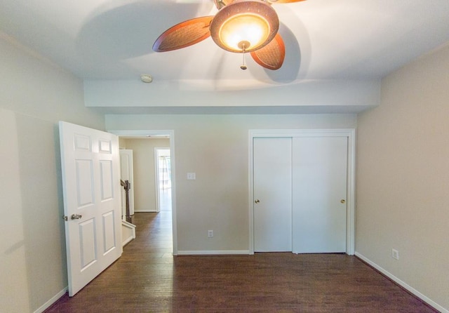 737 Davis Rd, League City, TX 77573 - unfurnished bedroom with ceiling fan, a closet, wood finished floors, and baseboards