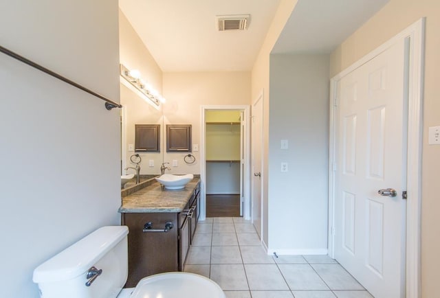 737 Davis Rd, League City, TX 77573 - bathroom featuring visible vents, baseboards, toilet, vanity, and tile patterned flooring