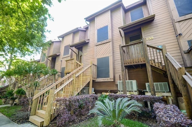 737 Davis Rd, League City, TX 77573 - rear view of property featuring stairs and central air condition unit