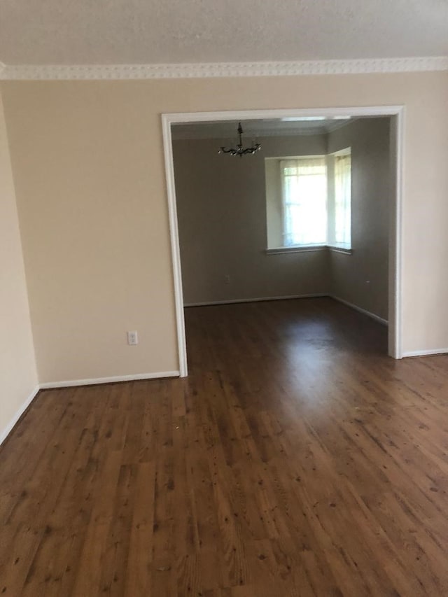 14407 Duncannon Dr, Houston, TX 77015 - empty room with crown molding, baseboards, and dark wood finished floors