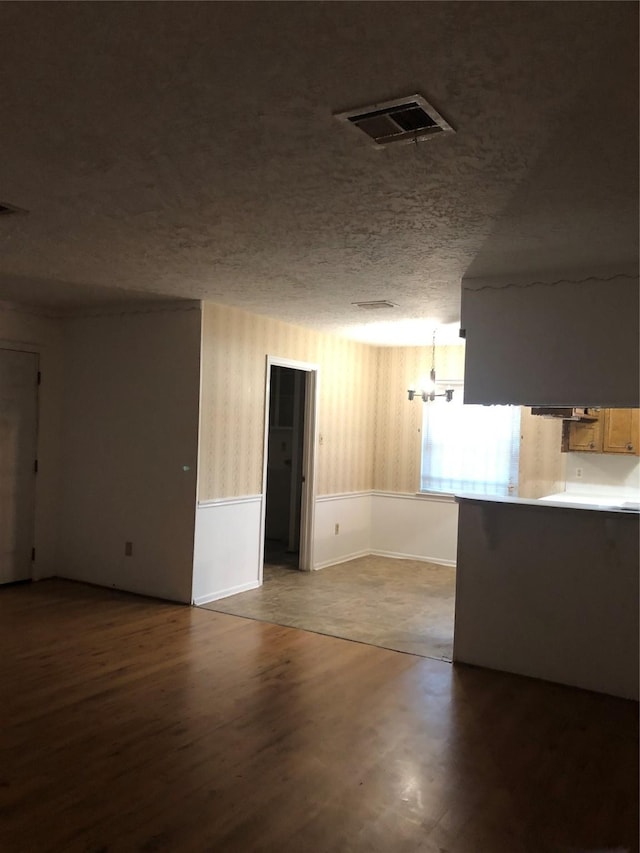 14407 Duncannon Dr, Houston, TX 77015 - unfurnished room with wood finished floors, visible vents, and a textured ceiling