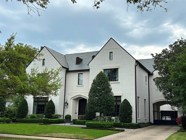 3717 Carlon St, Southside Place, TX 77005 - french country inspired facade with a high end roof, a front yard, and driveway