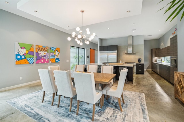 dining room with a chandelier, recessed lighting, concrete floors, and baseboards
