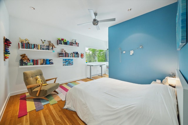 bedroom with wood finished floors, ceiling fan, baseboards, and recessed lighting
