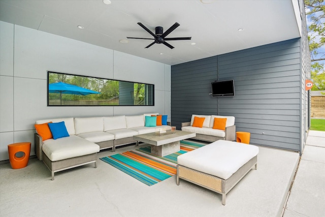 living room with a ceiling fan and recessed lighting