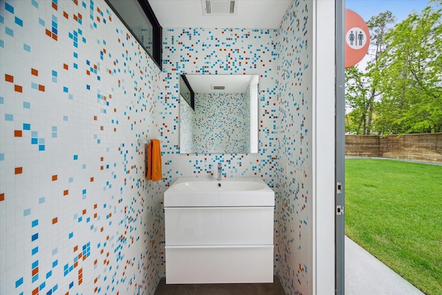 bathroom featuring vanity and visible vents