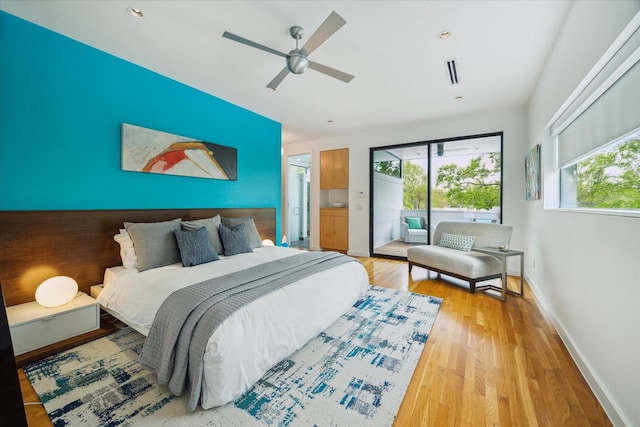 bedroom with visible vents, baseboards, ceiling fan, light wood-type flooring, and access to exterior