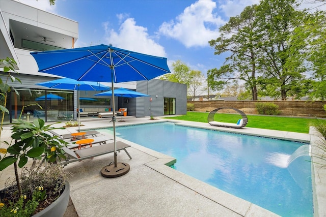 view of pool featuring a fenced in pool, a patio, an outdoor structure, a yard, and fence