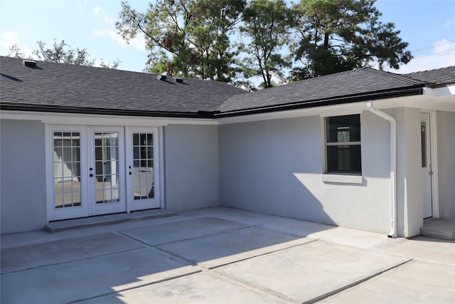 9121 Fordshire Dr, Houston, TX 77025 - rear view of property with a patio, a shingled roof, french doors, and stucco siding