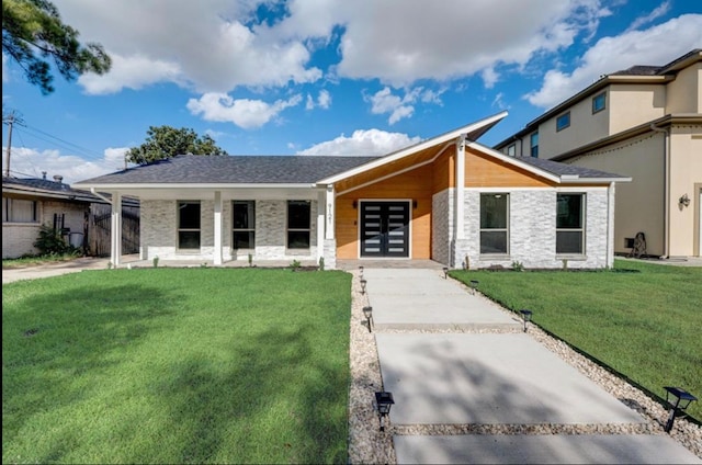 9121 Fordshire Dr, Houston, TX 77025 - view of front of home with stone siding and a front lawn