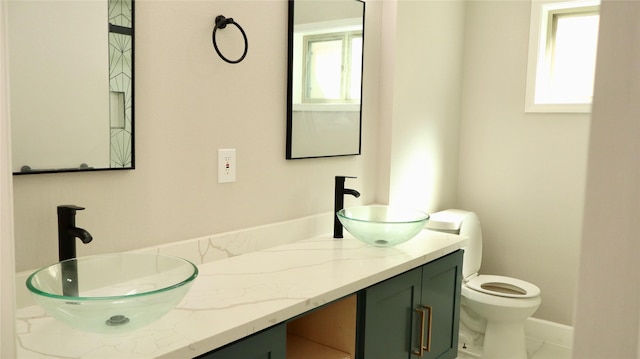 9121 Fordshire Dr, Houston, TX 77025 - bathroom featuring plenty of natural light, a sink, and toilet