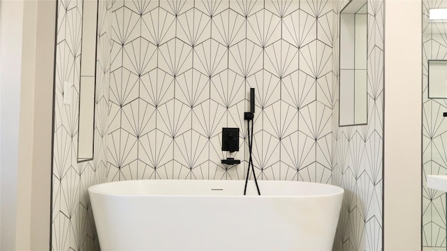 9121 Fordshire Dr, Houston, TX 77025 - full bathroom featuring a freestanding bath and tile walls