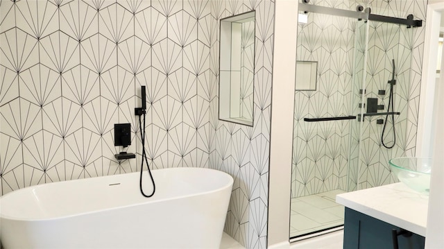 9121 Fordshire Dr, Houston, TX 77025 - full bath featuring tile walls, a shower stall, a freestanding tub, and vanity