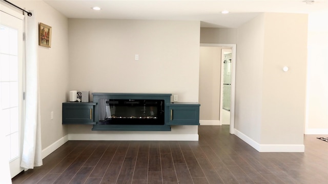 9121 Fordshire Dr, Houston, TX 77025 - unfurnished living room featuring recessed lighting, dark wood-style flooring, and baseboards
