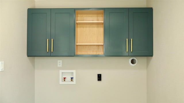 9121 Fordshire Dr, Houston, TX 77025 - clothes washing area with cabinet space, hookup for an electric dryer, and hookup for a washing machine
