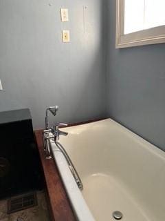 full bathroom featuring a tub to relax in