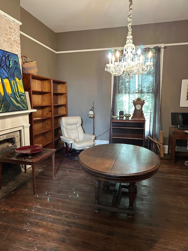 sitting room featuring a chandelier, hardwood / wood-style floors, and a fireplace