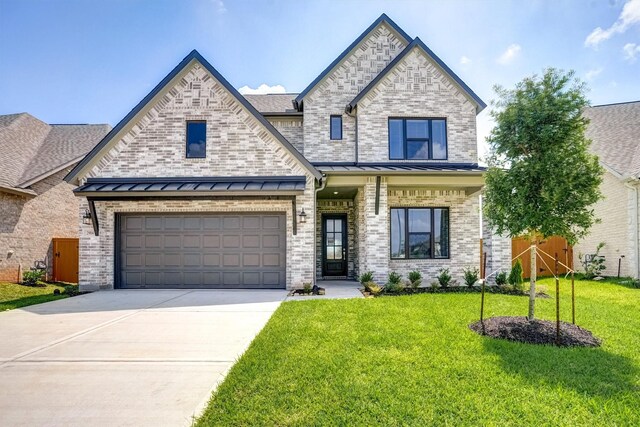2904 Apple Rose, Katy, TX 77493 - view of front of house with a garage, fence, concrete driveway, a front yard, and a standing seam roof