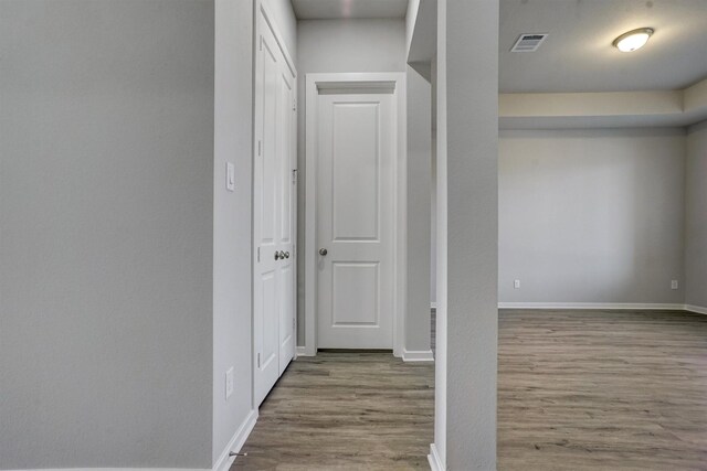2904 Apple Rose, Katy, TX 77493 - hallway with baseboards, visible vents, and wood finished floors
