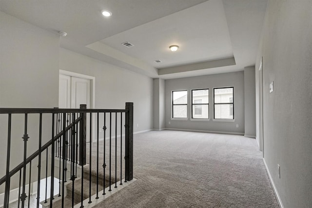 2904 Apple Rose, Katy, TX 77493 - empty room with carpet flooring, visible vents, baseboards, and a raised ceiling