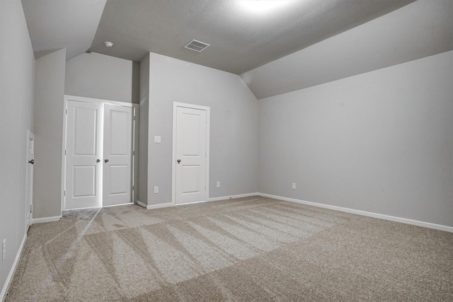 2904 Apple Rose, Katy, TX 77493 - additional living space featuring carpet flooring, vaulted ceiling, baseboards, and visible vents
