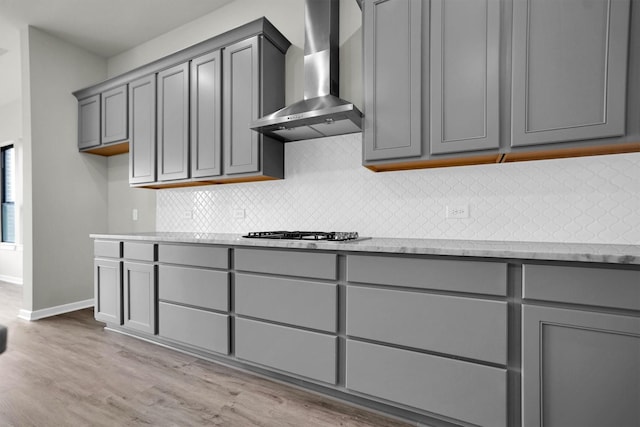 2904 Apple Rose, Katy, TX 77493 - kitchen with wall chimney range hood, gray cabinets, and baseboards