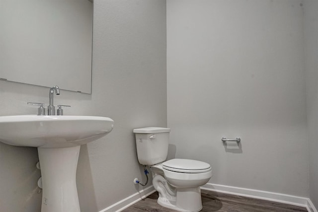 2904 Apple Rose, Katy, TX 77493 - bathroom featuring toilet, wood finished floors, and baseboards