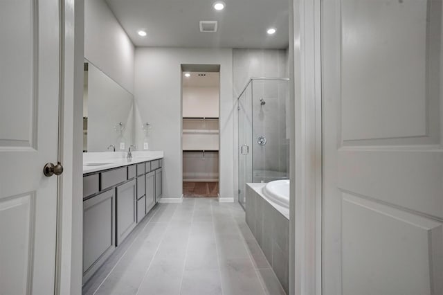 2904 Apple Rose, Katy, TX 77493 - full bathroom with recessed lighting, visible vents, a bath, a shower stall, and a spacious closet