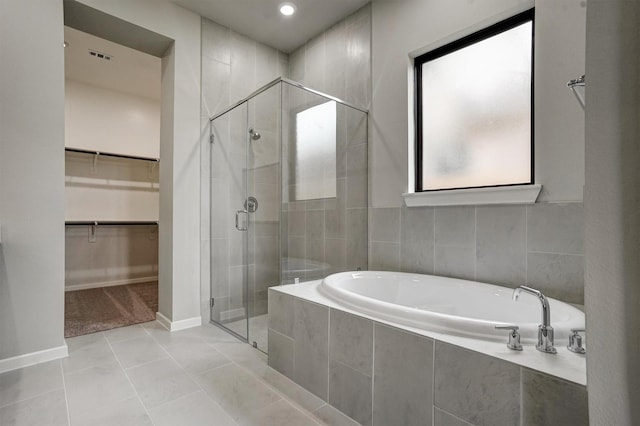 2904 Apple Rose, Katy, TX 77493 - full bathroom featuring tile patterned flooring, a spacious closet, a shower stall, and a bath