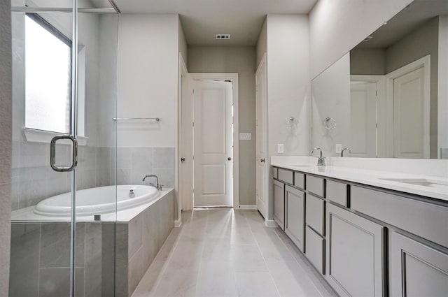 2904 Apple Rose, Katy, TX 77493 - bathroom featuring a sink, visible vents, tile patterned floors, double vanity, and a bath