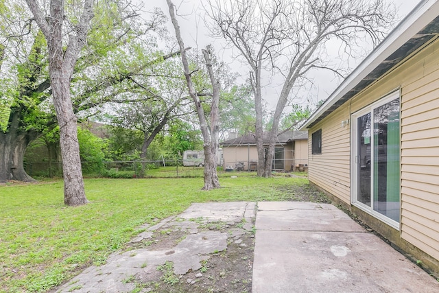 view of yard featuring fence and a patio area