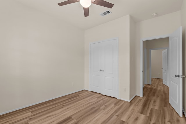 1069 Shadow Glenn Dr, Conroe, TX 77301 - unfurnished bedroom featuring light wood-type flooring, visible vents, baseboards, and ceiling fan