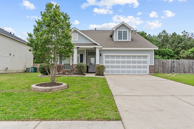 1069 Shadow Glenn Dr, Conroe, TX 77301 - craftsman-style home with a garage, fence, a front lawn, brick siding, and driveway