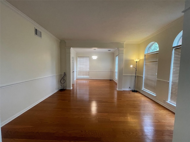 4311 Lakeside Meadow Dr, Missouri City, TX 77459 - interior space featuring baseboards, visible vents, crown molding, and wood finished floors