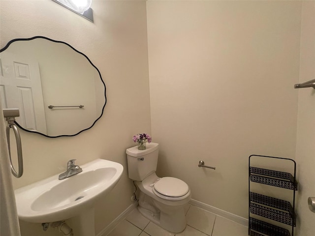 4311 Lakeside Meadow Dr, Missouri City, TX 77459 - bathroom with toilet, baseboards, tile patterned floors, a sink, and heating unit
