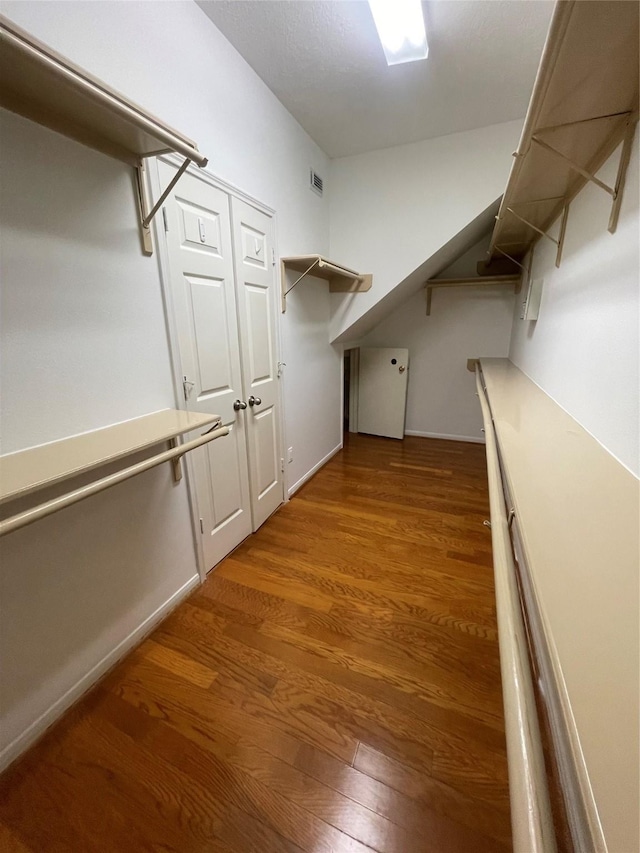4311 Lakeside Meadow Dr, Missouri City, TX 77459 - spacious closet featuring visible vents and wood finished floors