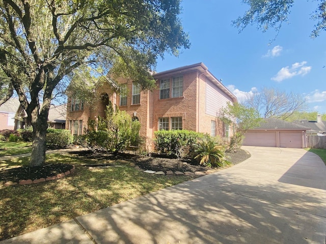 4311 Lakeside Meadow Dr, Missouri City, TX 77459 - colonial inspired home featuring driveway, an outdoor structure, brick siding, and a garage