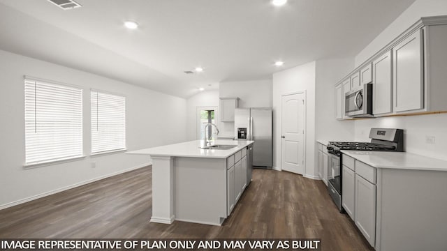 1342 Heather Rosewood Ln, Conroe, TX 77301 - kitchen with appliances with stainless steel finishes, a sink, dark wood-type flooring, an island with sink, and lofted ceiling